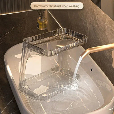 Water-resistant acrylic bathroom countertop organizer being rinsed under a faucet, showing easy-to-clean and rust-free design.