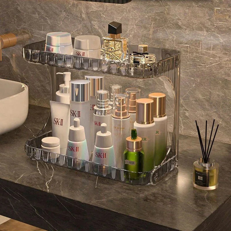Elegant bathroom countertop organizer storing SK-II and La Mer skincare products in a transparent acrylic rack