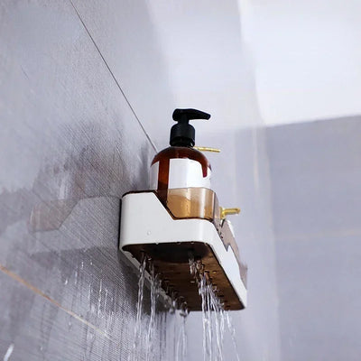 Bottom view of black shower caddy showing built-in drainage holes