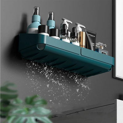 Wall-mounted small shower caddy with water drainage feature, holding multiple bathroom toiletries.
