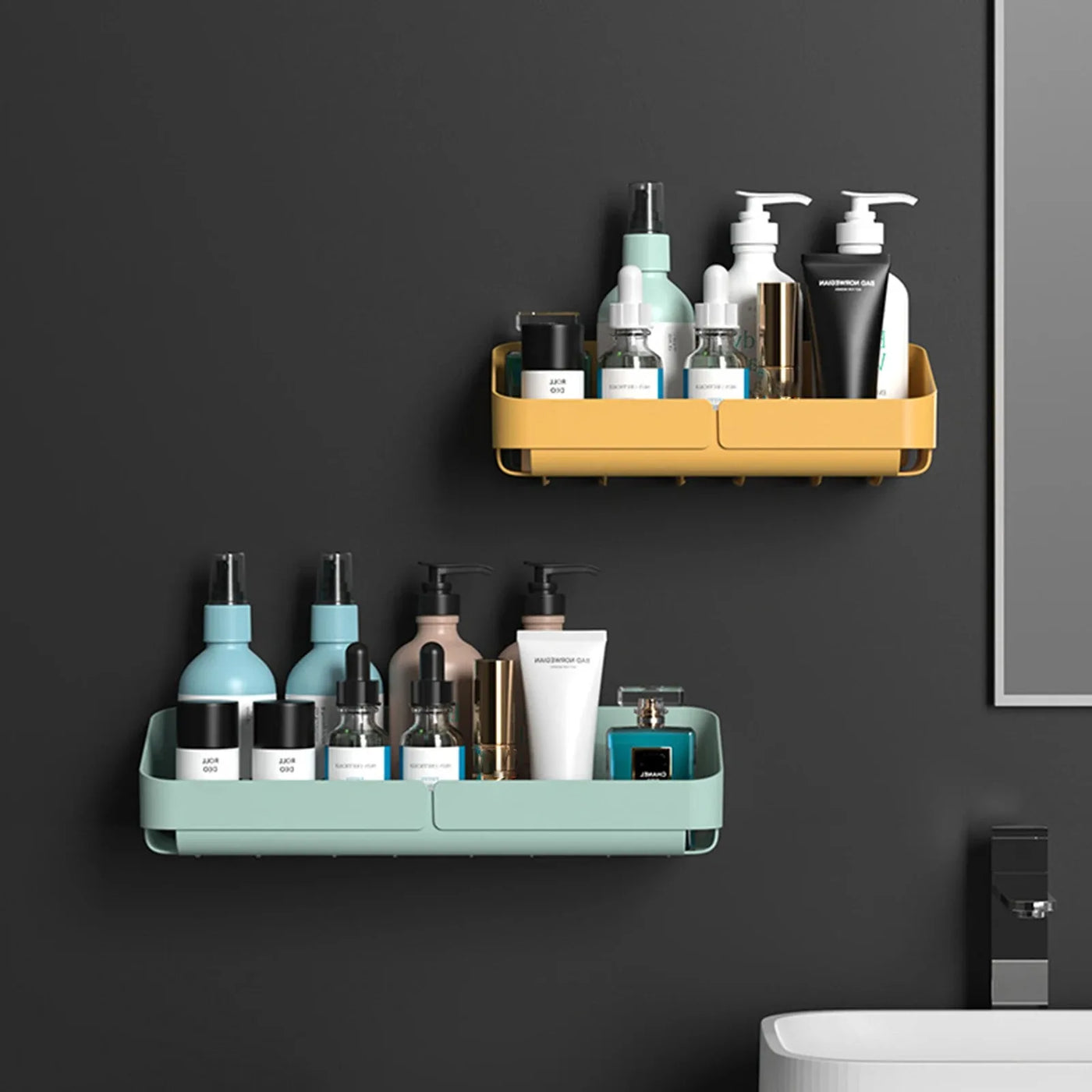 Two small shower caddies in yellow and green colors, mounted on bathroom wall and holding various bottles