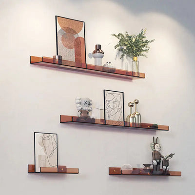 Modern floating corner shelf organizer rack in bronze finish holding framed art and decor pieces