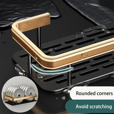 Close-up of gold stainless bathroom corner caddy organizer with rounded black shelves to prevent scratches.