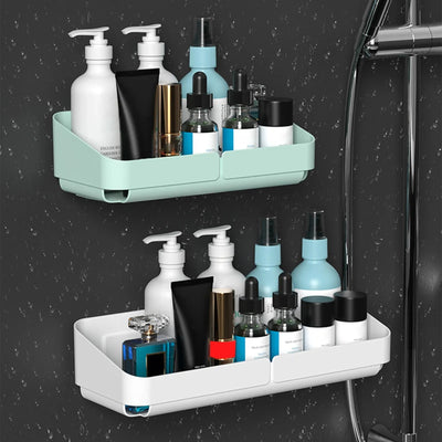 Two-tier small shower caddies in green and white mounted on wet shower wall