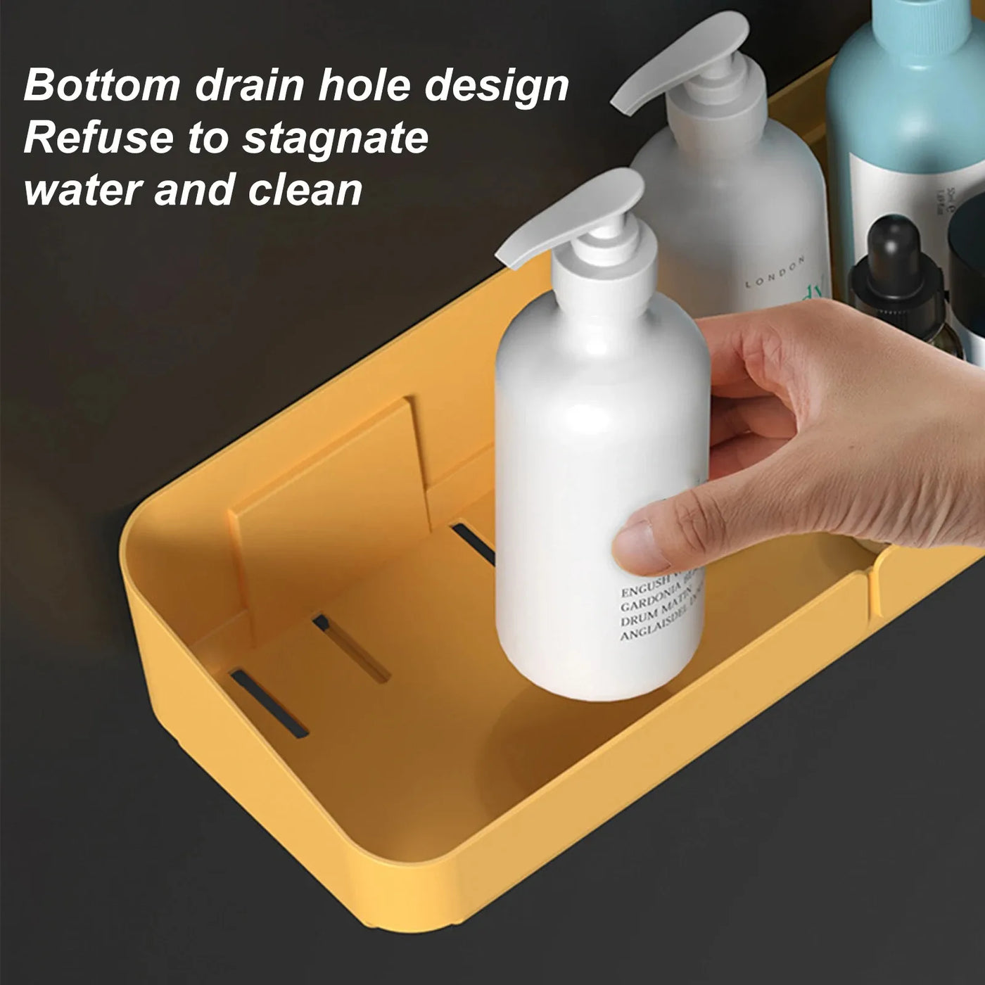 Close-up view of yellow small shower caddy with bottom drain slots for water flow